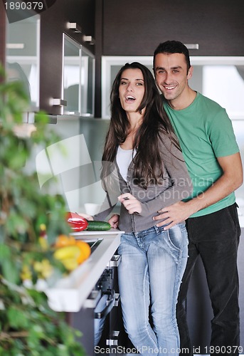 Image of young couple have fun in modern kitchen