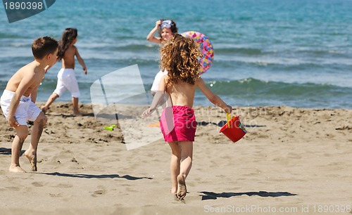 Image of child group have fun and play with beach toys