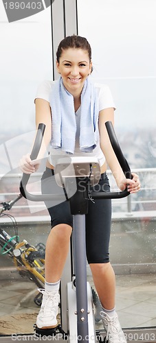 Image of woman workout  in fitness club on running track 