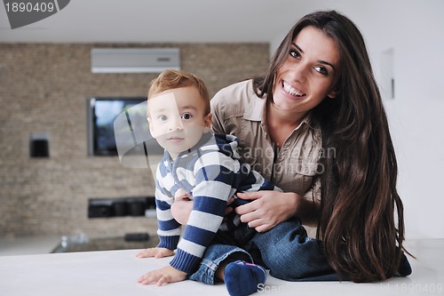 Image of happy mom and son together at home