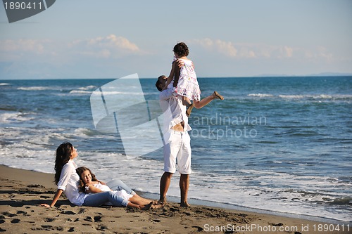 Image of happy young  family have fun on beach
