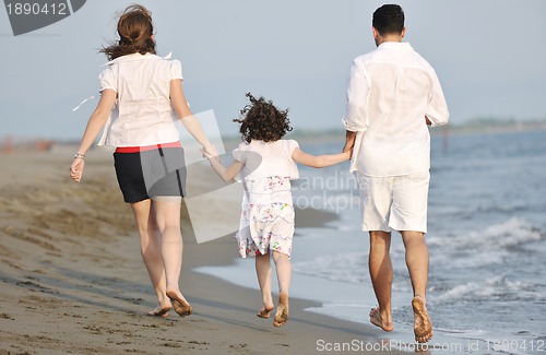 Image of happy young family have fun on beach