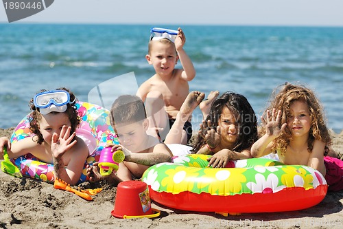 Image of child group have fun and play with beach toys