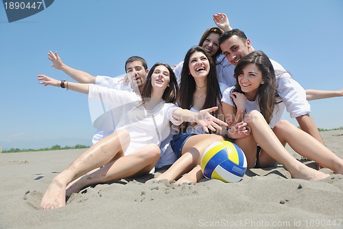 Image of happy young  people group have fun on beach