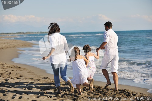 Image of happy young  family have fun on beach