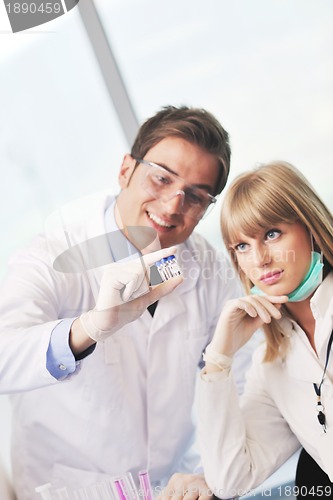 Image of science people in bright lab