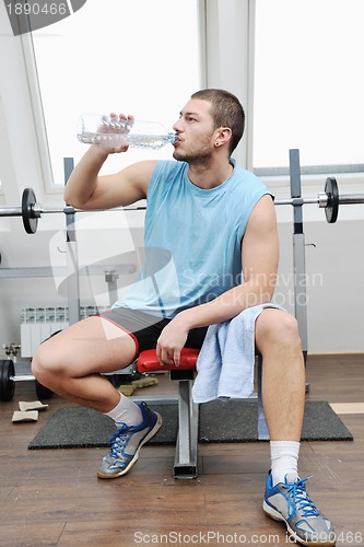 Image of man drink water at fitness workout