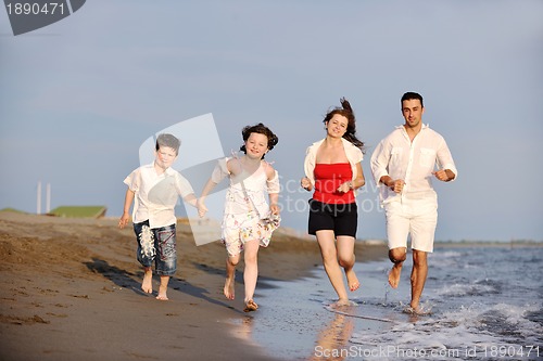 Image of happy young family have fun on beach