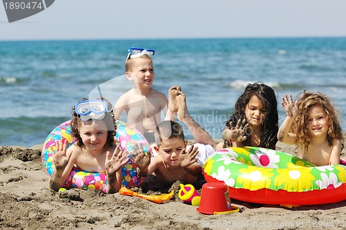 Image of child group have fun and play with beach toys