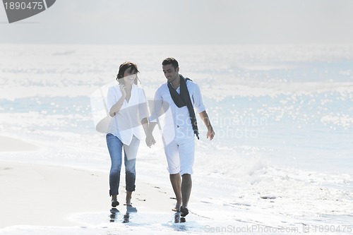 Image of happy young couple have fun at beautiful beach