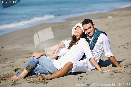 Image of happy young couple have fun at beautiful beach
