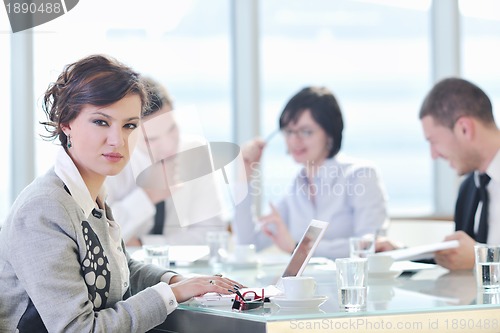 Image of group of business people at meeting