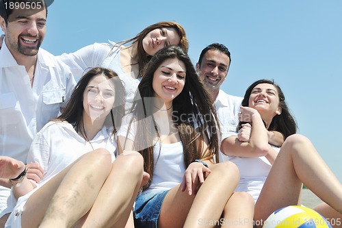 Image of Group of happy young people in have fun at beach