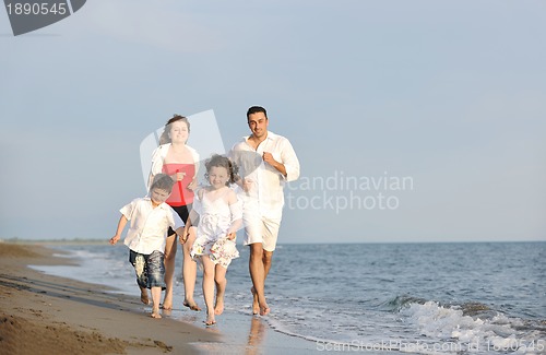 Image of happy young family have fun on beach