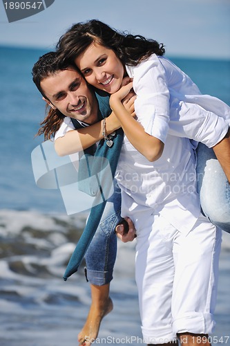 Image of happy young couple have fun at beautiful beach