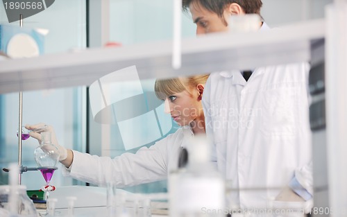 Image of science people in bright lab