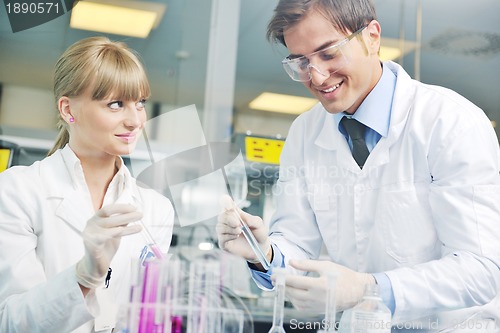 Image of science people in bright lab