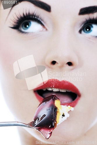 Image of beautiful young woman eat sweet cake