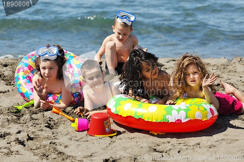 Image of child group have fun and play with beach toys