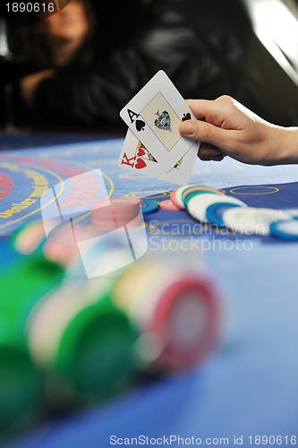 Image of woman play black jack card game in casino