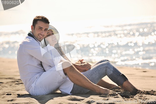 Image of happy young couple have fun at beautiful beach