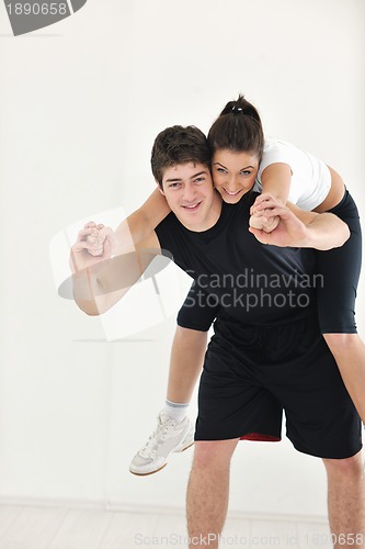Image of happy young couple fitness workout and fun
