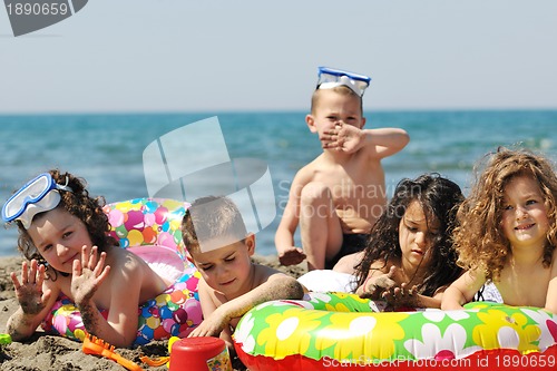 Image of child group have fun and play with beach toys