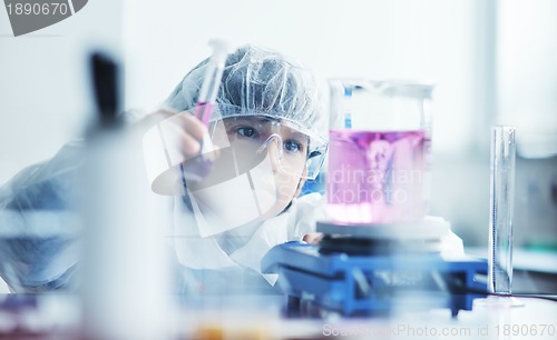 Image of little child scientist in lab