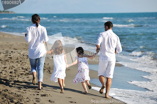 Image of happy young  family have fun on beach