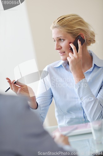 Image of young business woman on meeting