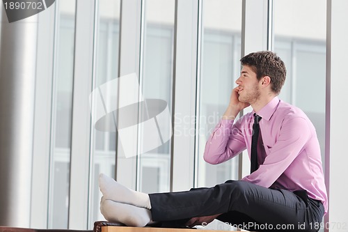 Image of young business man talk by cellphone