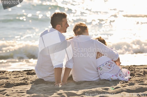 Image of happy young  family have fun on beach