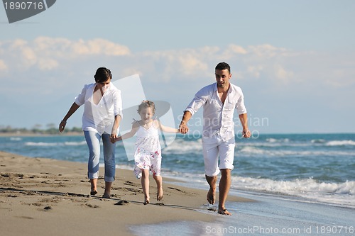 Image of happy young  family have fun on beach