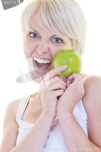 Image of happy  young  woman eat green apple isolated  on white