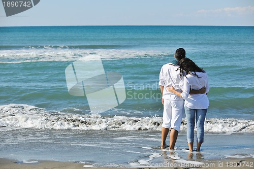 Image of happy young couple have fun at beautiful beach