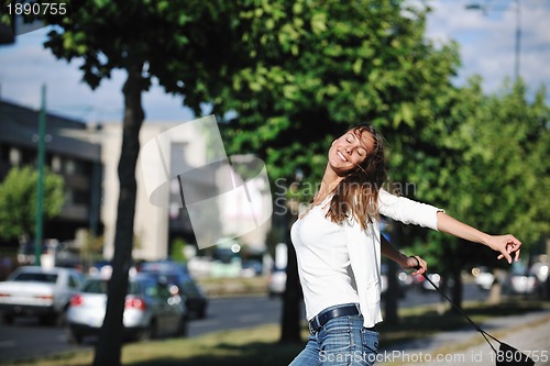 Image of young woman havefun at street 