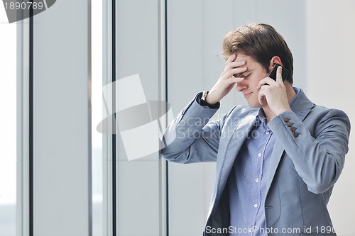 Image of young business man talk by cellphone