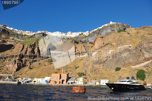 Image of santorini island coast with luxury yacht