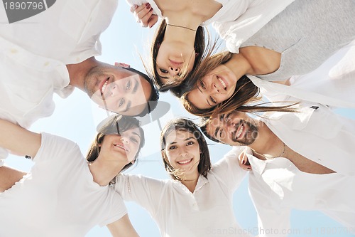 Image of Group of happy young people in have fun at beach