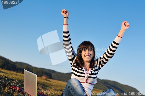 Image of young teen girl work on laptop outdoor