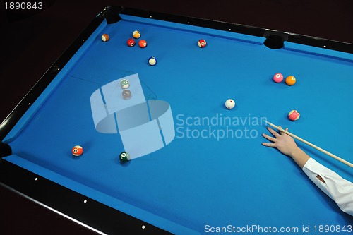 Image of young man play pro billiard game 