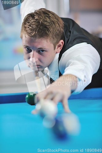 Image of young man play pro billiard game 