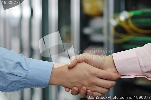 Image of it engineers in network server room