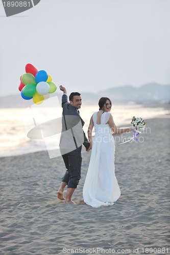 Image of romantic beach wedding at sunset