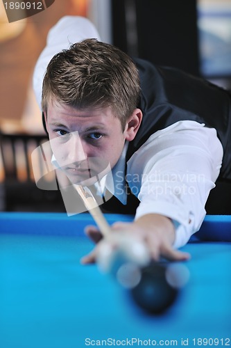 Image of young man play pro billiard game 