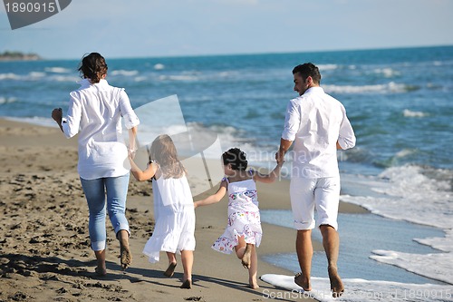 Image of happy young  family have fun on beach