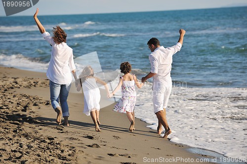 Image of happy young  family have fun on beach