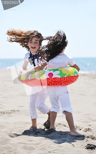 Image of happy young  people group have fun on beach