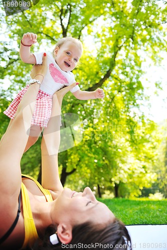 Image of woman and baby have playing at park
