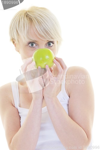 Image of happy  young  woman eat green apple isolated  on white